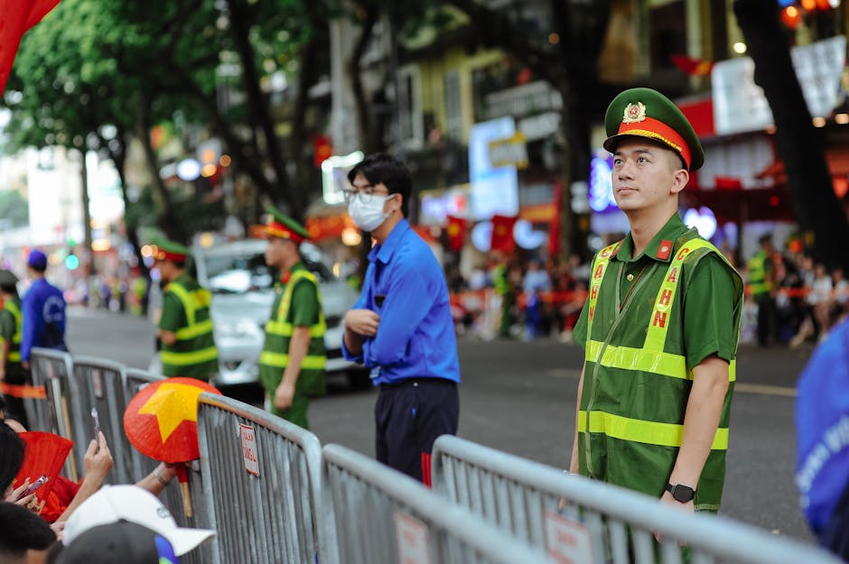 Vietnamese police officers managing crowd
