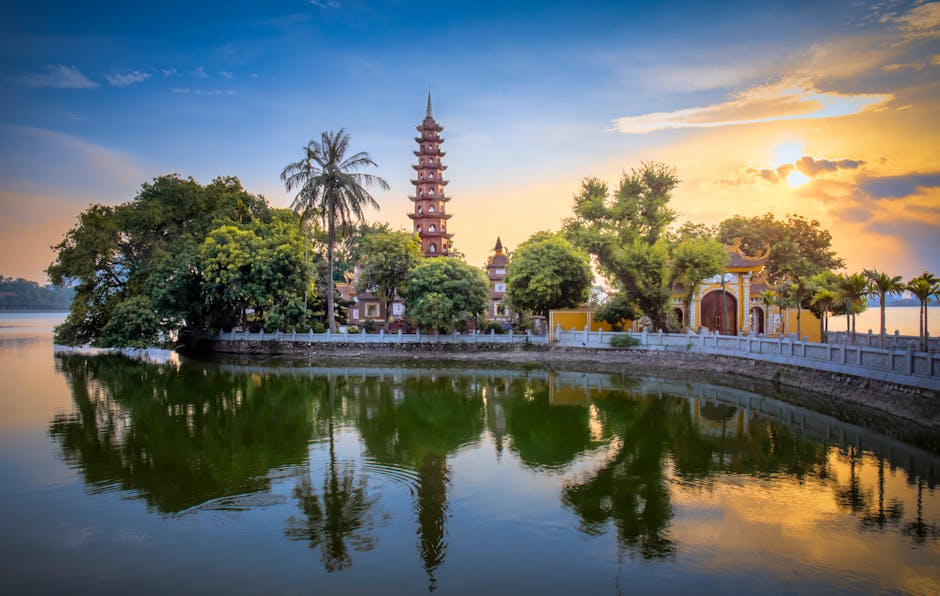 Stunning sunset Tran Quoc Pagoda reflecting West Lake