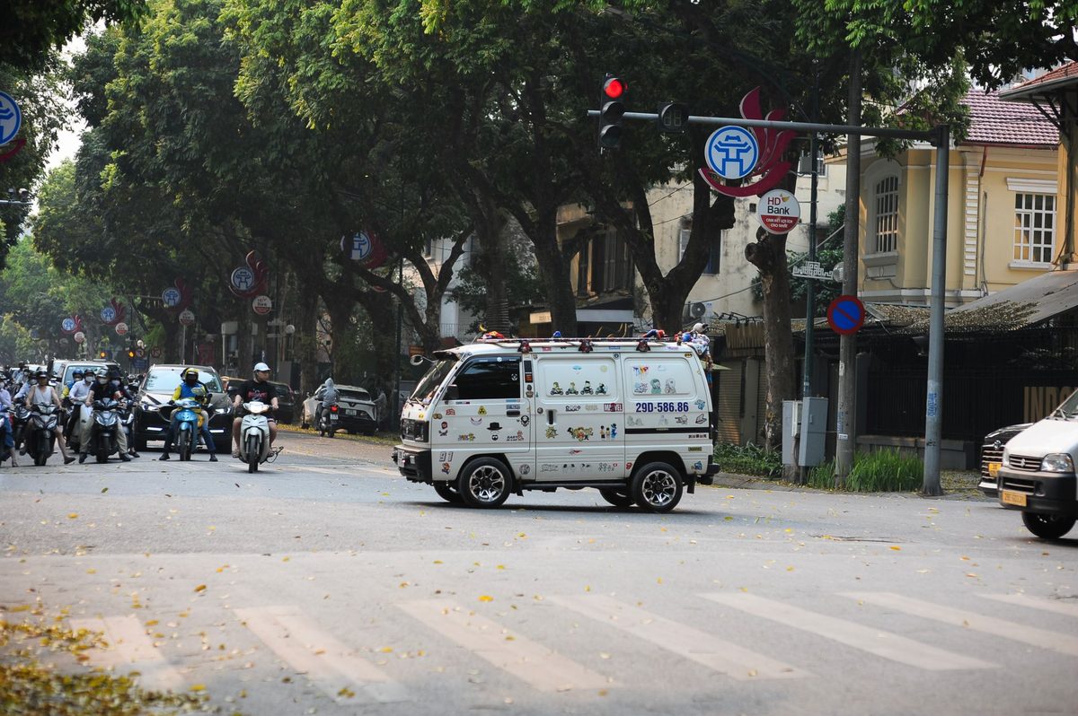 Hanoi Safety Tips: Complete Practical Guide for Travelers (2026) 3 Crossing a Hanoi street through motorbike traffic — moving slowly and predictably is the key safety tip