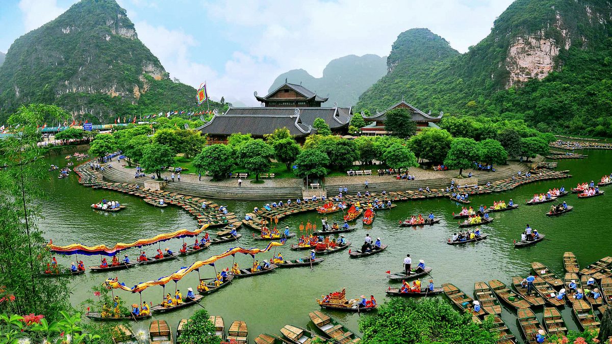 A scenic riverside temple trip of the kind found at the Perfume Pagoda near Hanoi